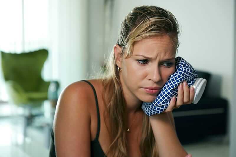 woman suffering from malocclusions or bad bites