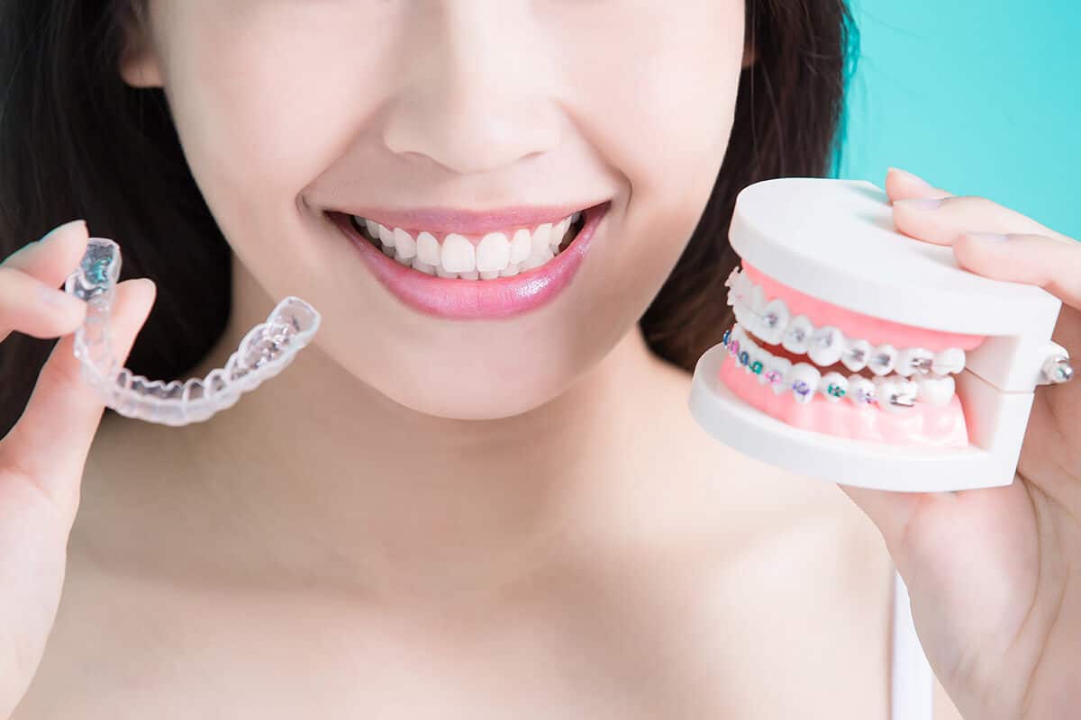 a young woman learning about how to straighten teeth